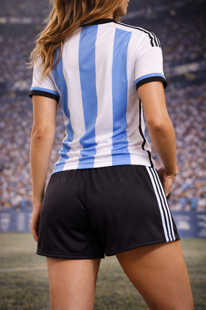 Woman wearing a blue and white striped sports jersey with black shorts on a stadium background