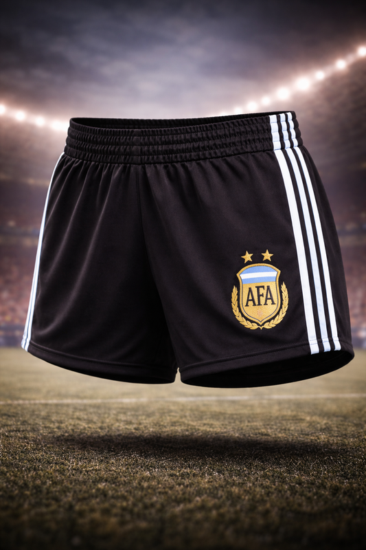 Black Argentina Inspired female shorts with a logo on a sports field background
