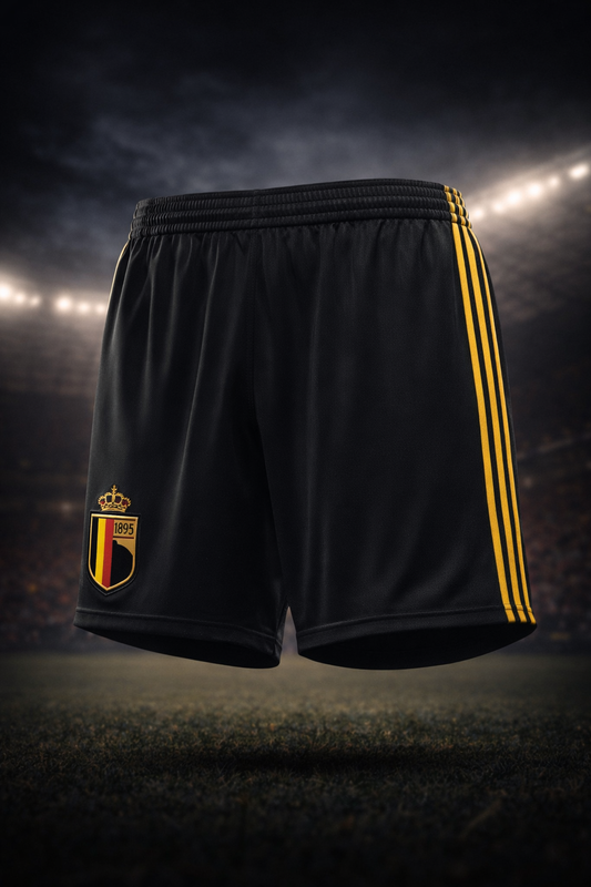 Black shorts with yellow stripes and a logo on a dark background